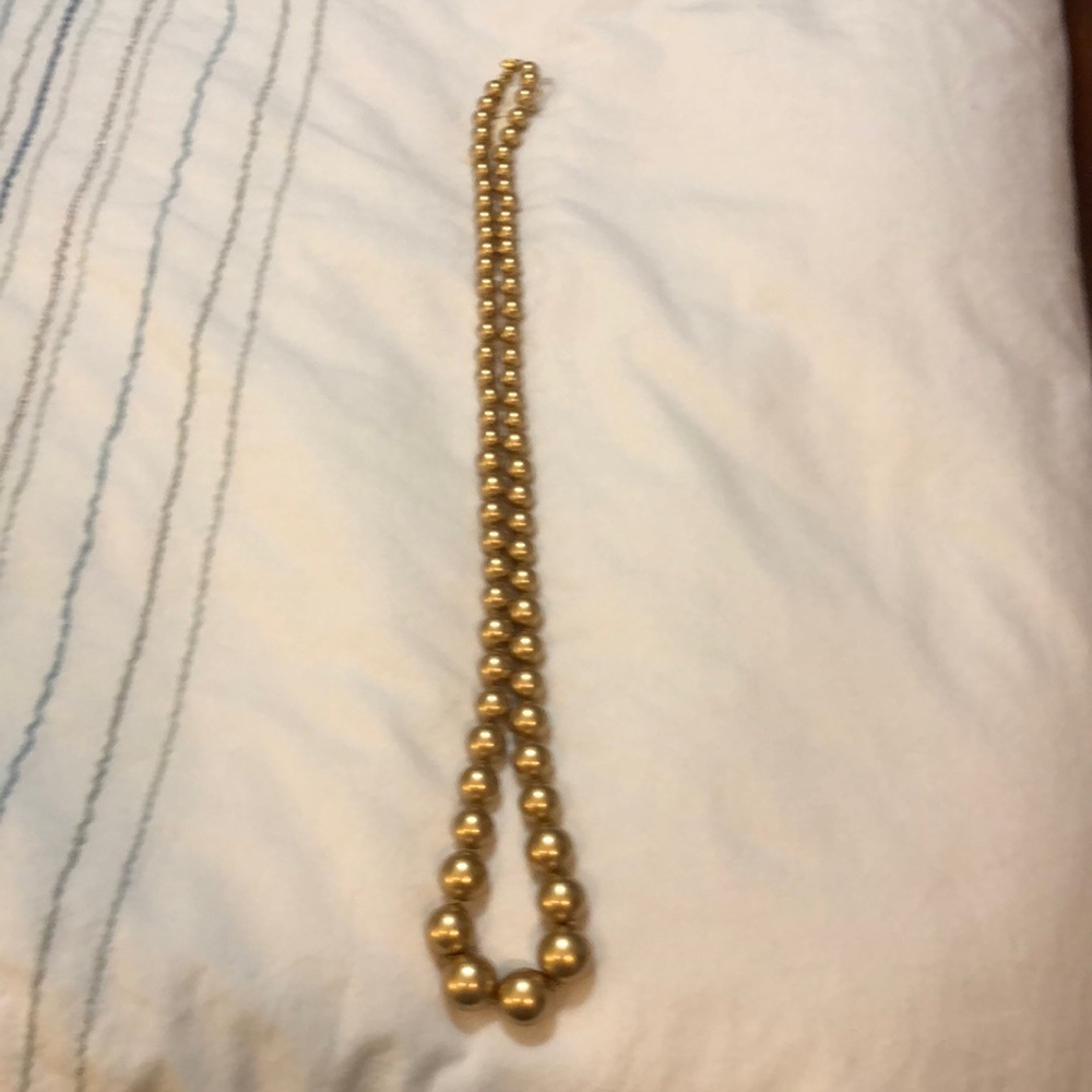 New with tags very long gold color necklace